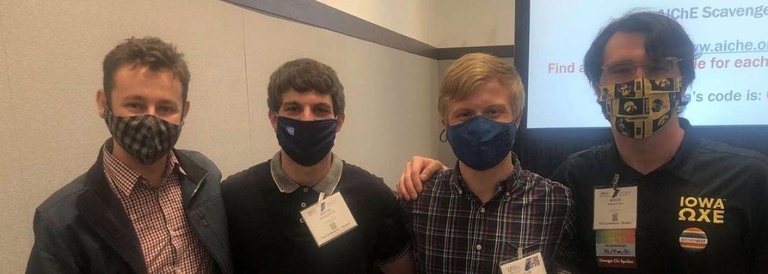 Photo of four students wearing masks