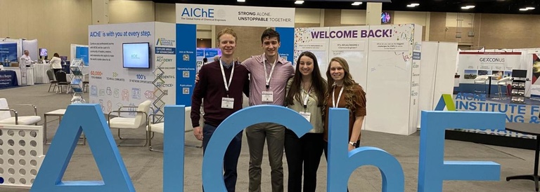 Four students pose for a photo at 2022 AIChE Spring Meeting 