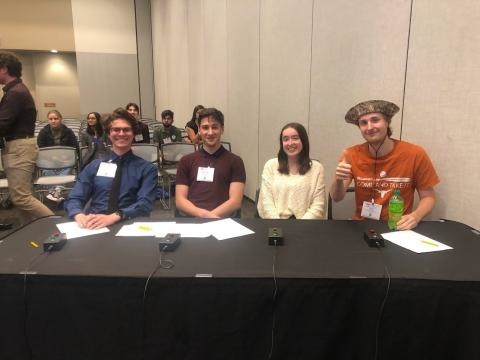 Four students at a table