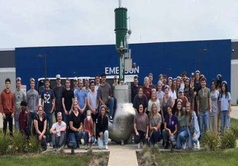 Group of students outside a plant
