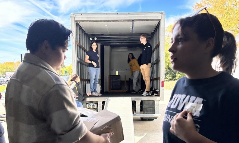 Students loading a truck