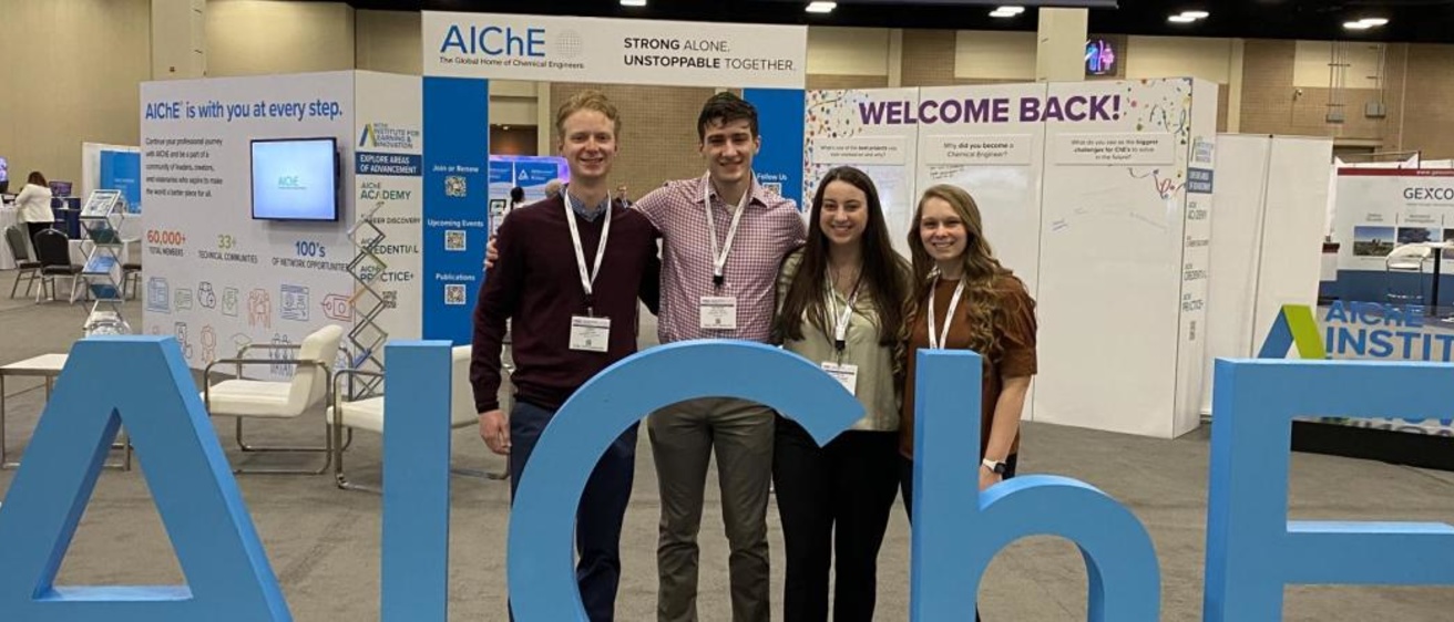 Four students pose for a photo at 2022 AIChE Spring Meeting 